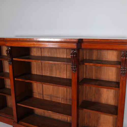 172 - Mid-Victorian mahogany break front bookcase, with scroll top column detail, height 119cm, width 185c... 