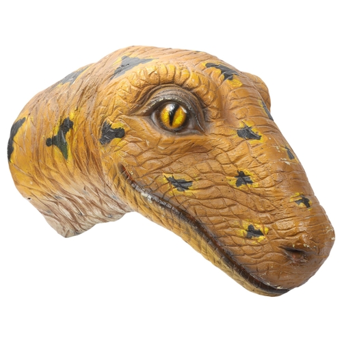 103 - A modern composition wall-mounted dinosaur head, length 63cm