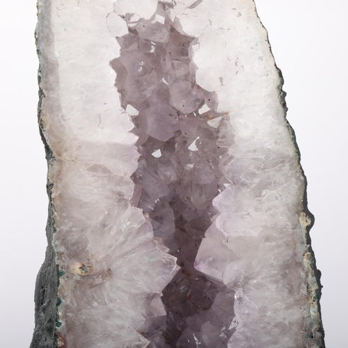 105 - A large clear amethyst cathedral geode, 31.9kg, height 70cm, width 25cm