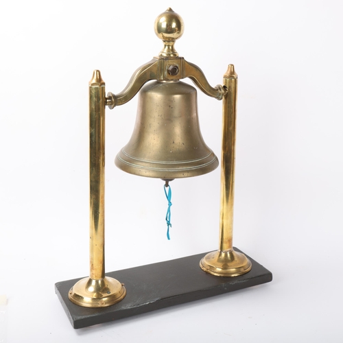 117 - 19th century brass ship's bell from the Ithuriel 1856, mounted on brass and wood stand, overall heig... 