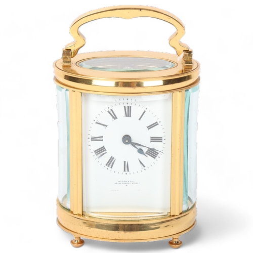 127 - A modern oval brass-cased carriage clock, with 8-day movement, Wilson & Gill Regent Street London, c... 