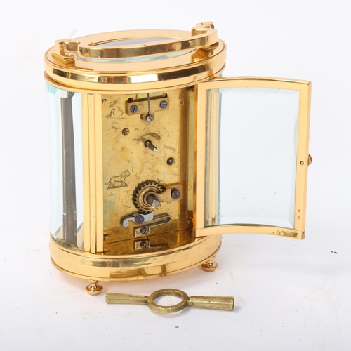 127 - A modern oval brass-cased carriage clock, with 8-day movement, Wilson & Gill Regent Street London, c... 