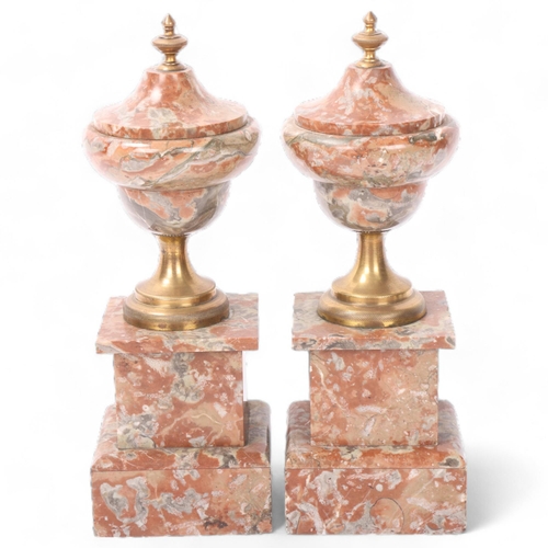 142 - Pair of brass and marble ornamental urns, height 28cm