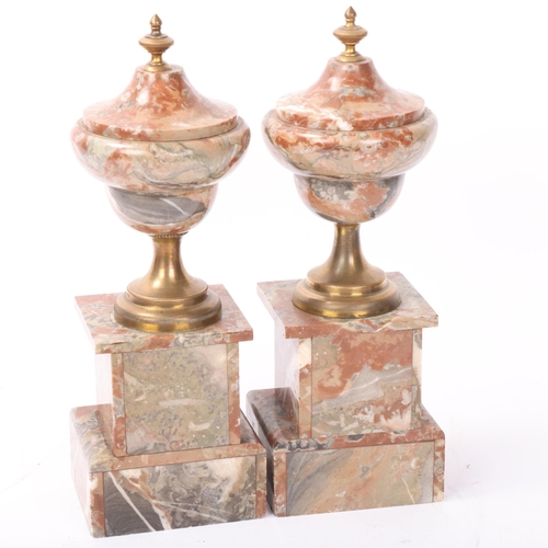 142 - Pair of brass and marble ornamental urns, height 28cm