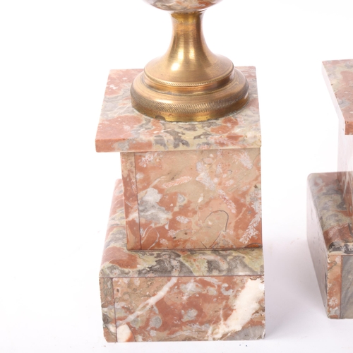 142 - Pair of brass and marble ornamental urns, height 28cm