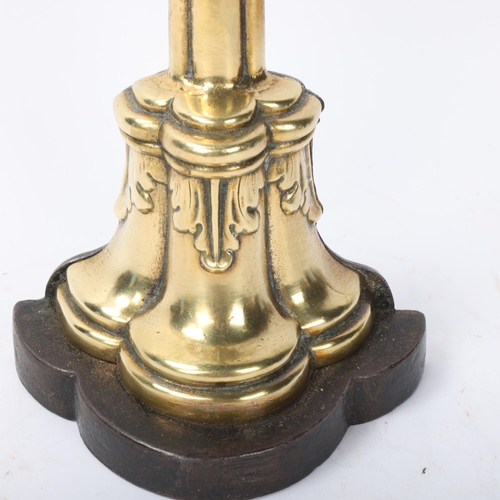 144 - Victorian brass and cast-iron doorstop, with acanthus handle, height 39cm