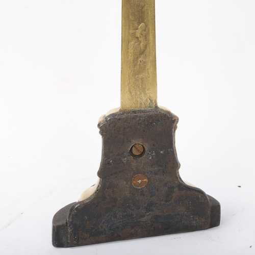 144 - Victorian brass and cast-iron doorstop, with acanthus handle, height 39cm