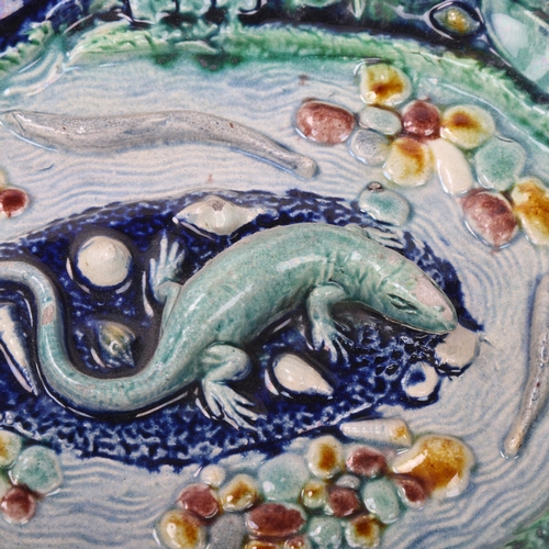 147 - 19th century Palissy style faience pottery bowl, relief lizard fish and frog decoration, in blue and... 