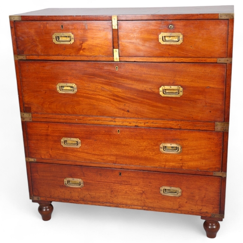 174 - A 19th century brass-bound mahogany military chest of drawers in 2 sections, with recessed brass han... 