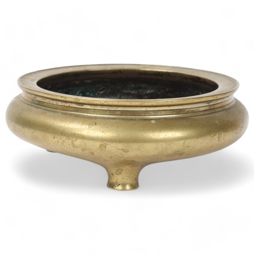 183 - A Chinese polished bronze incense burner on 3 feet, impressed 6 character mark, rim diameter 14cm, h... 