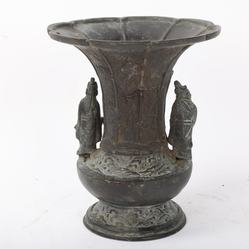 186 - A Chinese patinated bronze vase with flared rim, surmounted by figures and buffalo, height 17.5cm, d... 