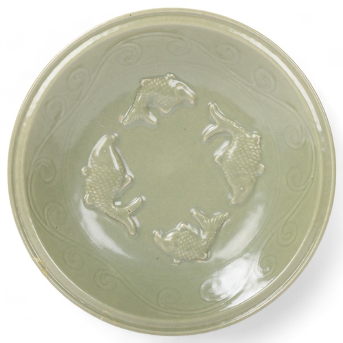 188 - A Chinese celadon glaze porcelain bowl, with relief fish designs, diameter 30.5cm