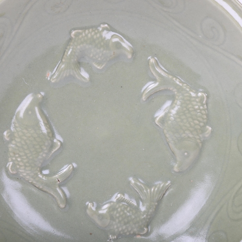 188 - A Chinese celadon glaze porcelain bowl, with relief fish designs, diameter 30.5cm