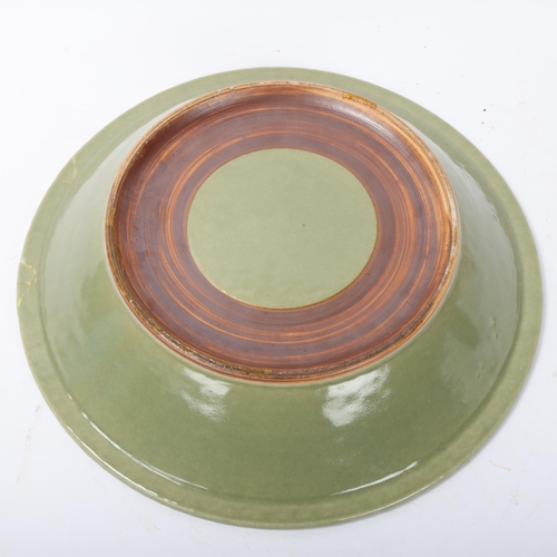 188 - A Chinese celadon glaze porcelain bowl, with relief fish designs, diameter 30.5cm