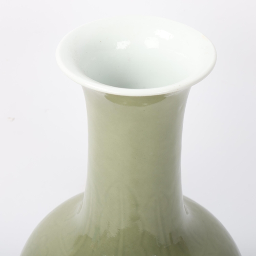 192 - A Chinese celadon glaze porcelain baluster vase, with incised decoration, height 30cm, drilled