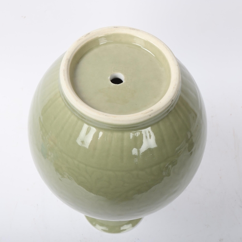 192 - A Chinese celadon glaze porcelain baluster vase, with incised decoration, height 30cm, drilled