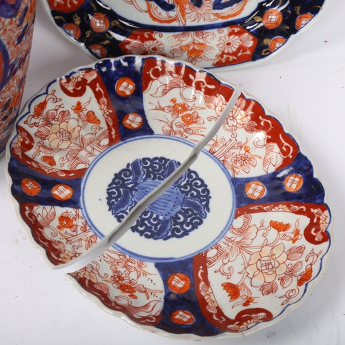 196 - A Chinese blue and red decorated Imari porcelain vase, height 30cm, and 2 similar Imari plates (1 br... 