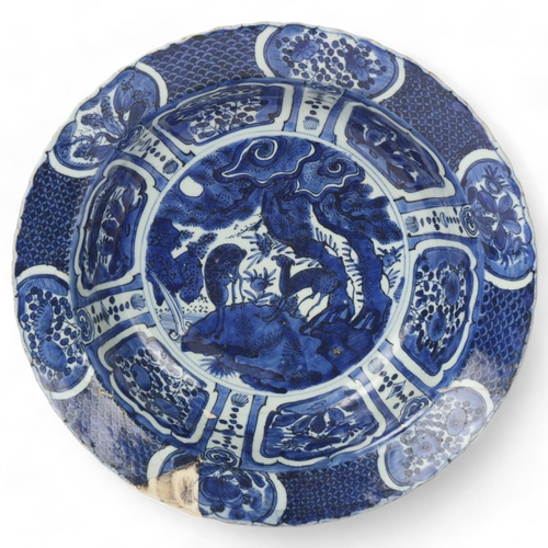 198 - A large Chinese blue and white porcelain bowl, decorated with deer in landscape, diameter 36cm, rest... 