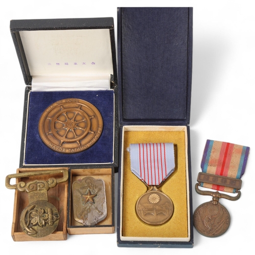 203 - A group of Japanese medals and medallions