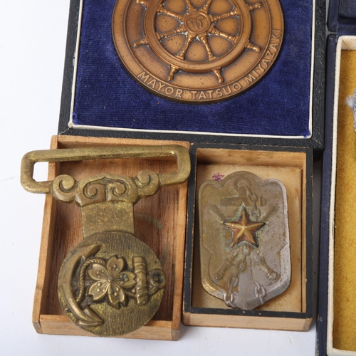 203 - A group of Japanese medals and medallions