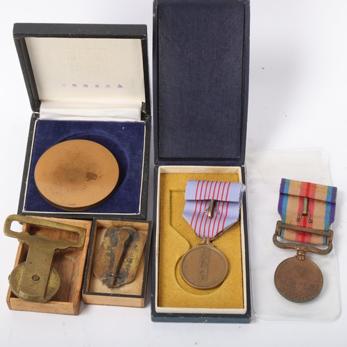 203 - A group of Japanese medals and medallions