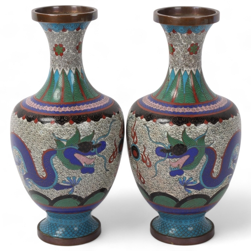 207 - A pair of Chinese cloisonne enamel dragon design vases, height 23cm