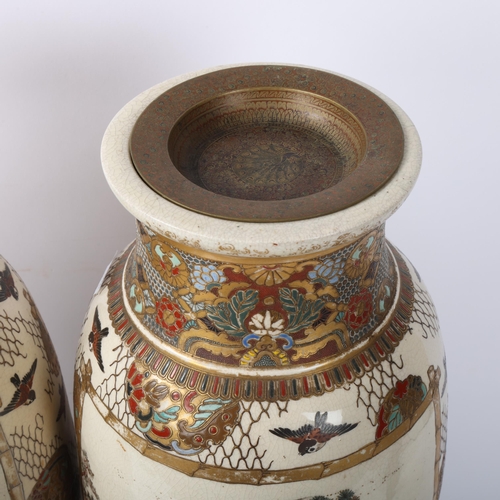 219 - A pair of Japanese Satsuma porcelain vases, with painted and gilded warriors, on carved wood stands,... 