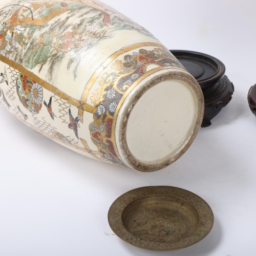 219 - A pair of Japanese Satsuma porcelain vases, with painted and gilded warriors, on carved wood stands,... 