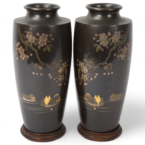 220 - A pair of Japanese inlaid and patinated bronze vases, decorated with ducks and blossom trees, height... 