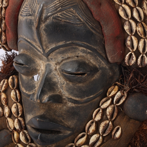 221 - African Dan headdress, carved wood with shell mounts, Ivory Coast, height approx 38cm