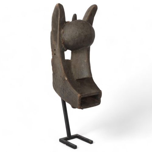 226 - Bamana (West Africa) carved wood Tribal mask, on metal stand, overall height 58cm