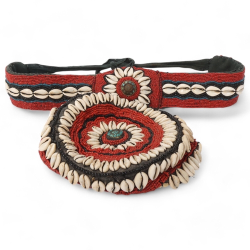 228 - An African Tribal cap and belt, with cowrie shell and coral bead decoration (2)