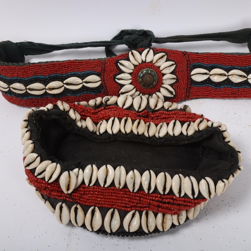 228 - An African Tribal cap and belt, with cowrie shell and coral bead decoration (2)