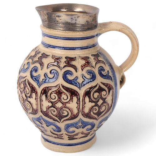 240 - 17th century German Westerwald salt glaze stoneware jug or krug, applied moulded decoration, with co... 