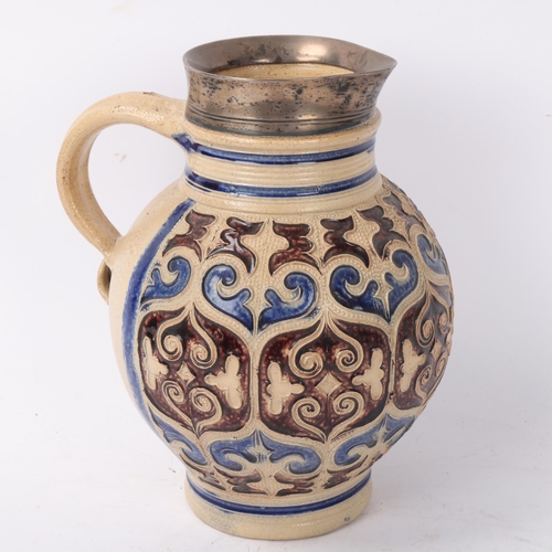 240 - 17th century German Westerwald salt glaze stoneware jug or krug, applied moulded decoration, with co... 