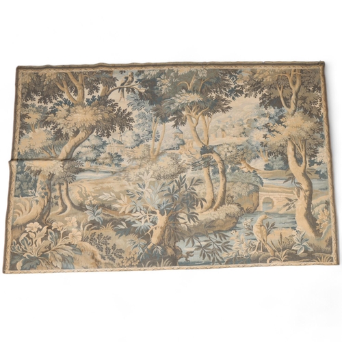 289 - A large French machine-woven verdure wall-hanging tapestry, Continental hillside village, 190cm x 13... 