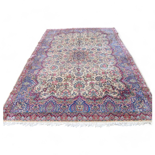 291 - A large Persian Aalam ivory ground wool rug, 500cm x 315cm