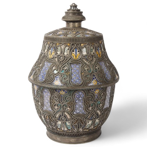 242 - A large Moorish Moroccan ceramic jar and cover, with white metal overlay decoration, height 41cm