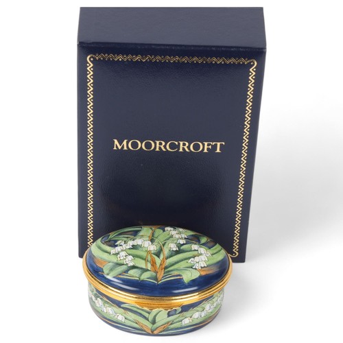 249 - MOORCROFT - an enamel box, lily of the valley design, length 6.5cm, boxed