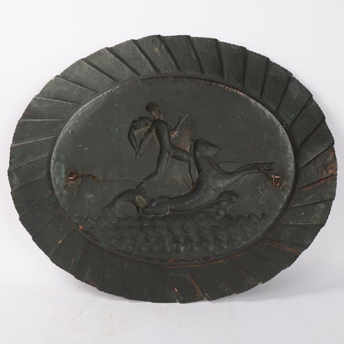 255 - A large Greek embossed copper oval plaque, length 58cm