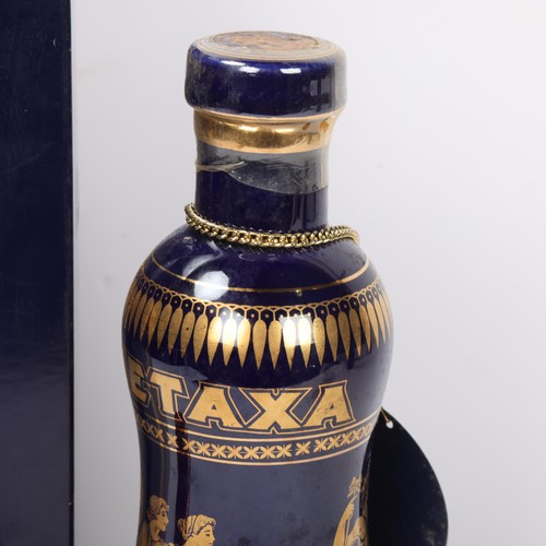 266 - A bottle of Metaxa Centenary edition in presentation box, with similar miniature edition, 70cl 40%