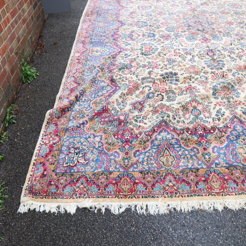 291 - A large Persian Aalam ivory ground wool rug, 500cm x 315cm