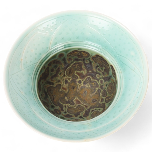 401 - GEOFFREY SWINDELL (born 1945); a small porcelain bowl covered in layers of glaze, slip and oxides, i... 