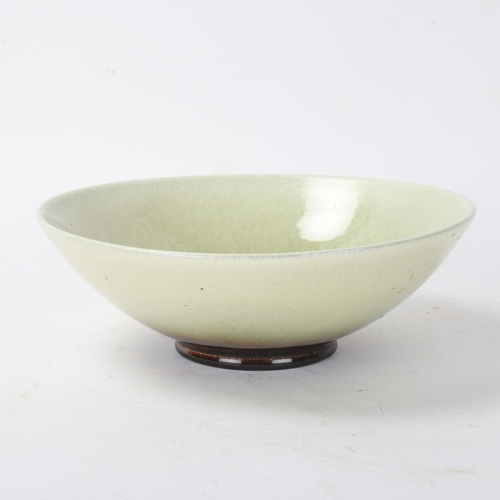 402 - VICKE LINDSTRAND for Upsala Ekeby, a Marianne series ceramic bowl circa 1960, green glaze with hare'... 