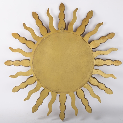 409 - A mid 20th century convex sunburst mirror, signed to rim STALLIC, diameter 57cm