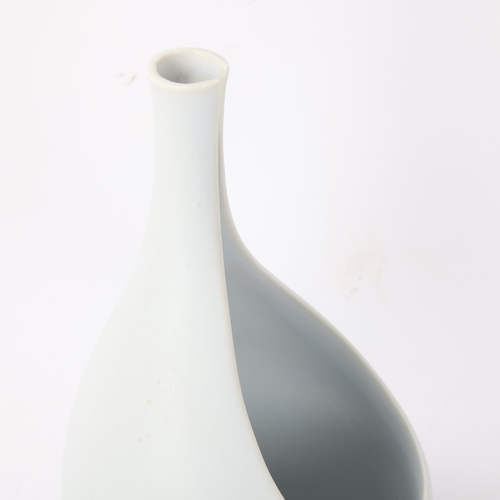 424 - STIG LINDBERG (1916-1981) for Gustavsberg, Sweden, a 1950s' designed white glaze Pungo vase, makers ... 