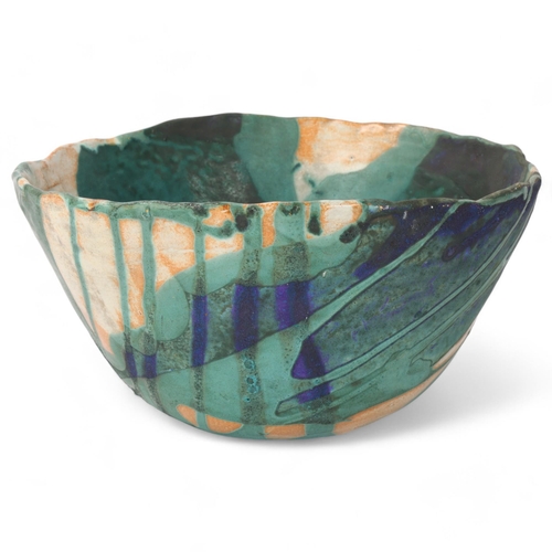 426 - A studio pottery stoneware bowl with layered glaze decoration, makers monogram to base 