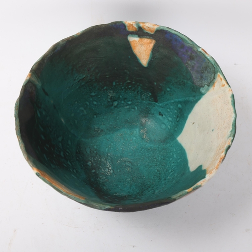 426 - A studio pottery stoneware bowl with layered glaze decoration, makers monogram to base 