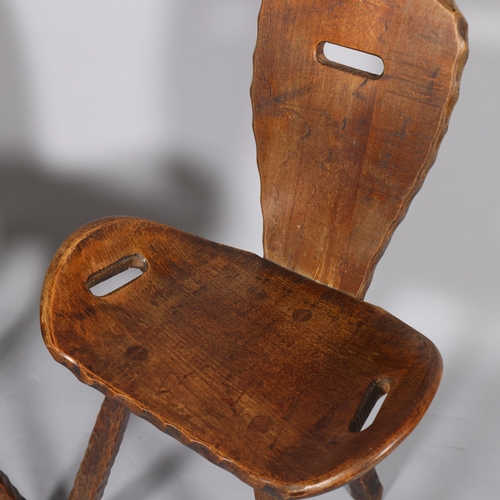 428 - A pair of mid-century French brutalist chairs, the shaped seats with integral handles, height 80cm