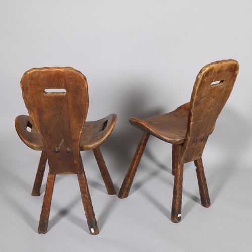 428 - A pair of mid-century French brutalist chairs, the shaped seats with integral handles, height 80cm